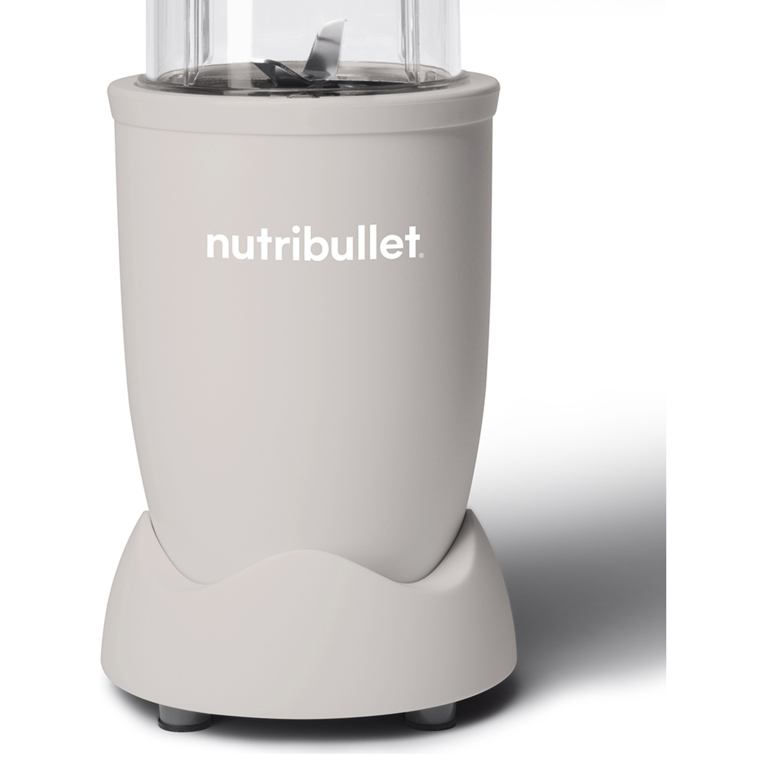 A gray Nutribullet blender on a white background. It has a clear top and blades visible. The brand name is on the front.