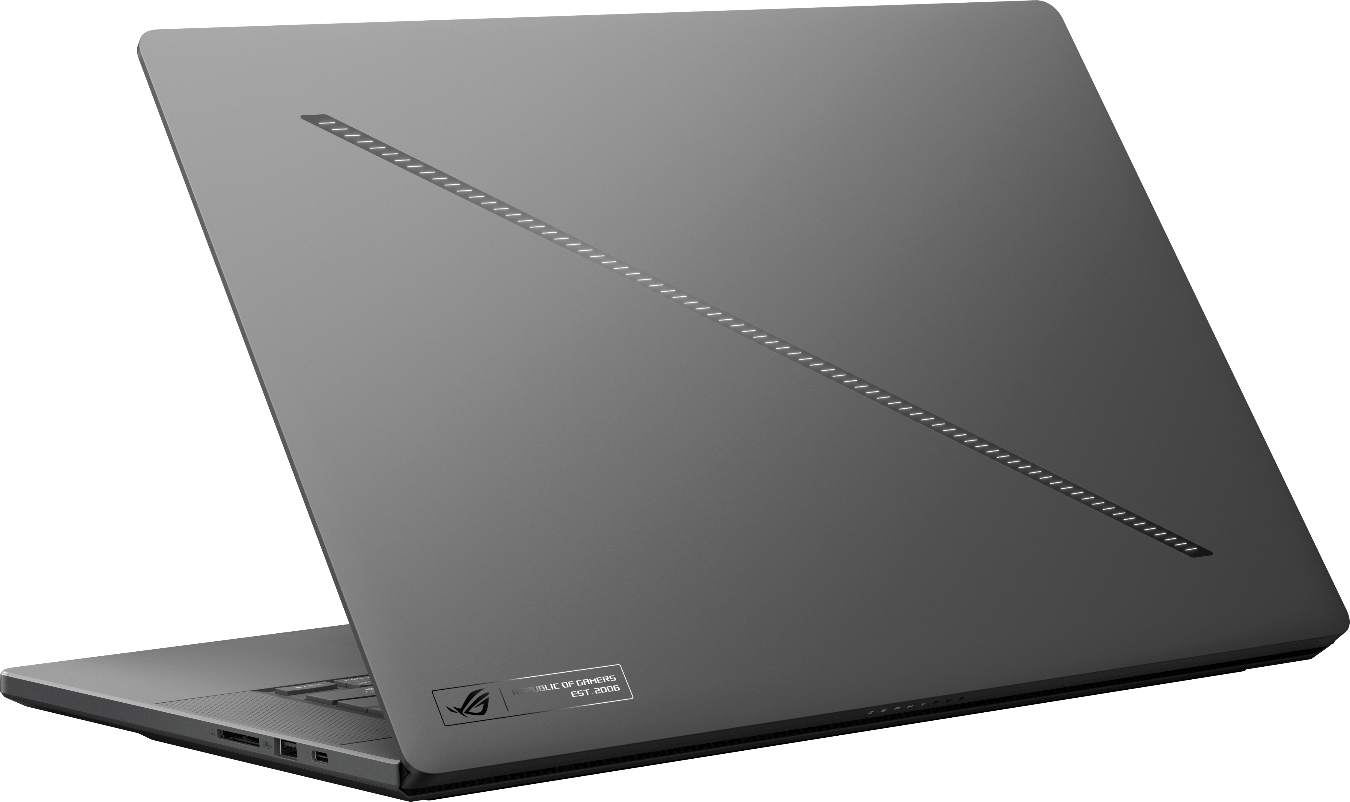 Un ordinateur portable gris est légèrement ouvert. L'arrière a un design et un logo. La zone du clavier est visible avec des ports sur le côté.