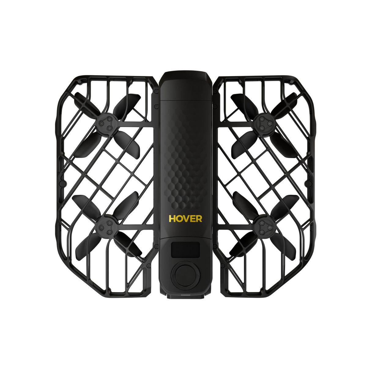 Schwarze Drohne mit vier Propellern, geschützt durch einen Käfig. Der Körper trägt das Wort HOVER. Der Hintergrund ist weiß.