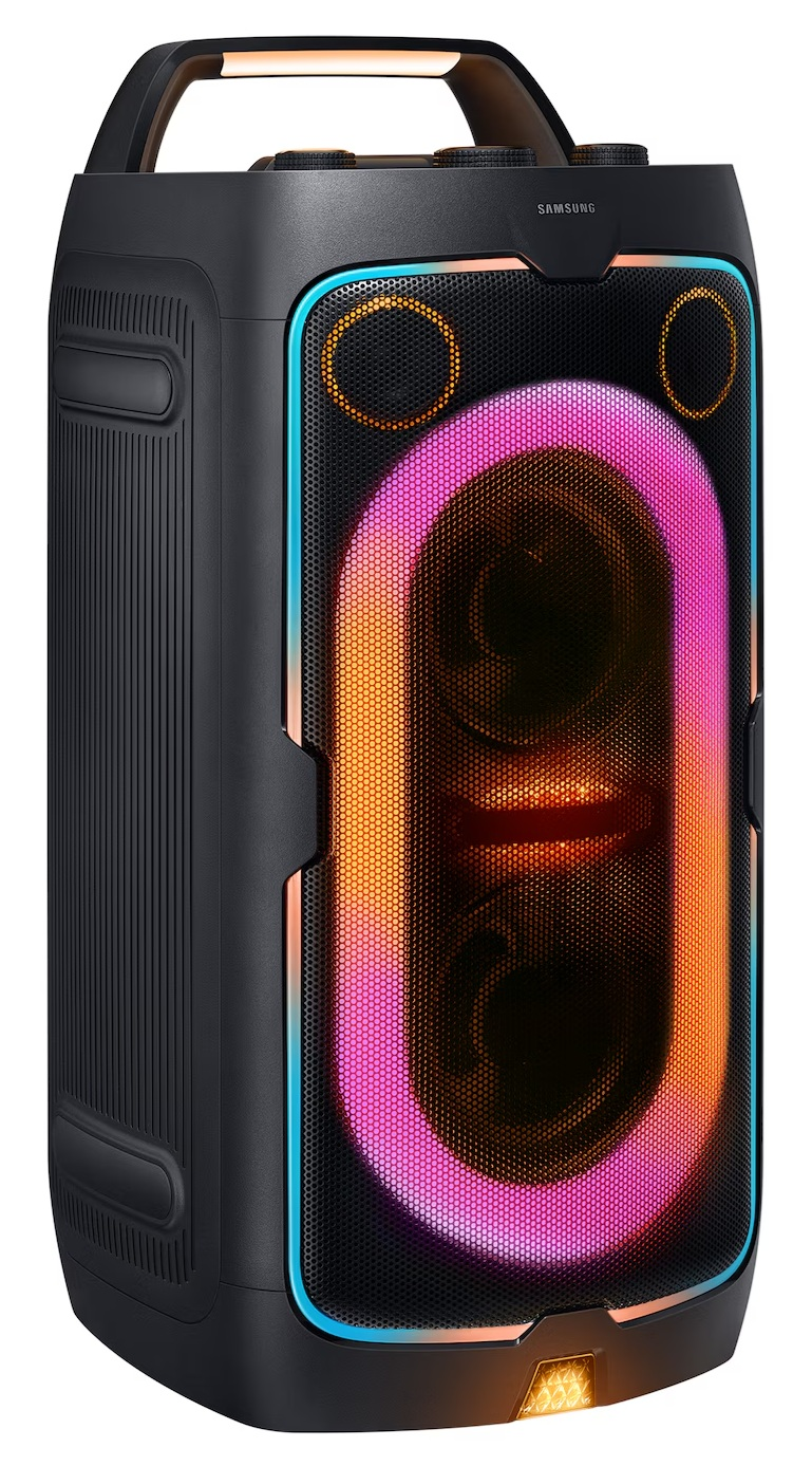 Czarny głośnik Samsung z świecącymi światłami. Ma uchwyt. Przód ma siatkową konstrukcję z kolorowymi światłami, w tym różowym i pomarańczowym.