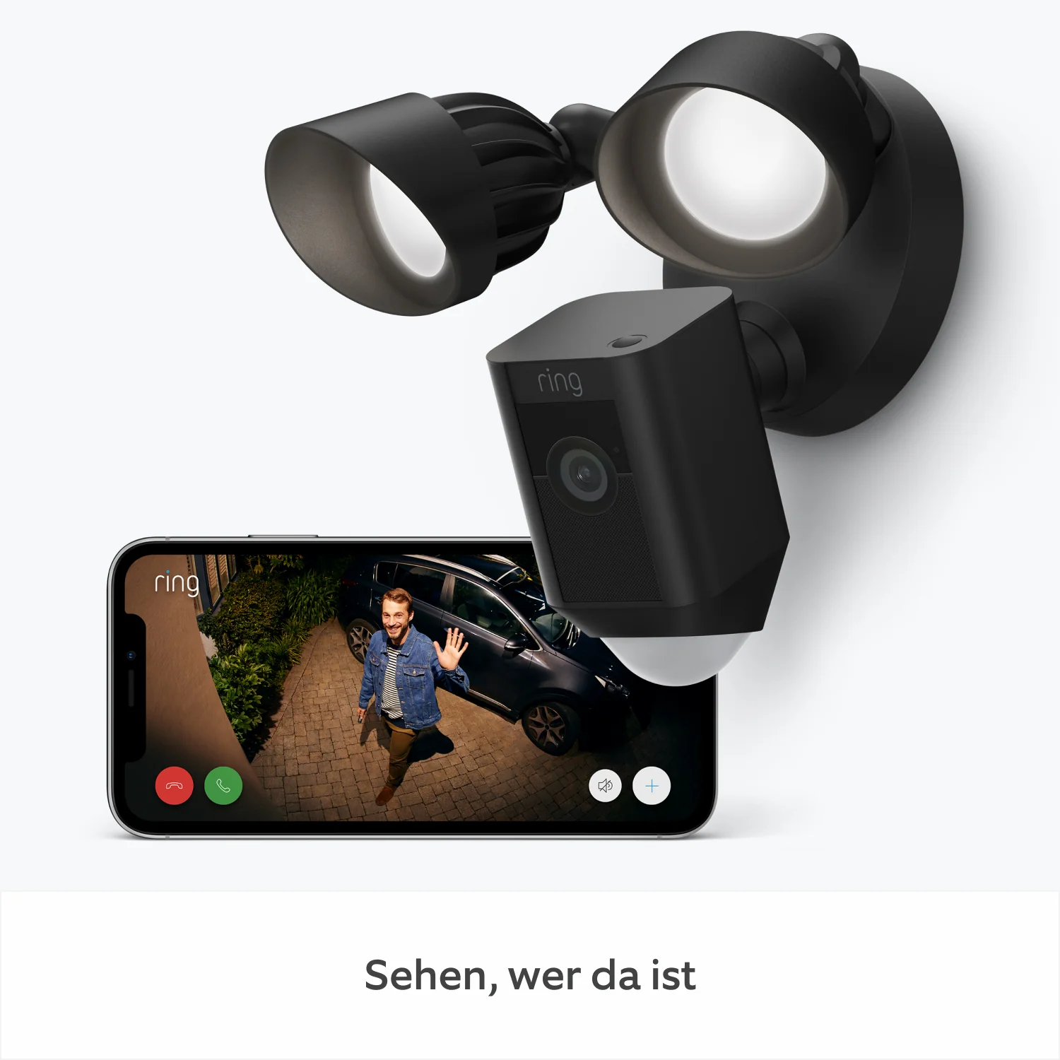 Schwarze Ring-Sicherheitskamera mit Flutlichtern. Auf dem Telefonbildschirm winkt eine Person in der Nähe eines Autos. Text: "Sehen, wer da ist".