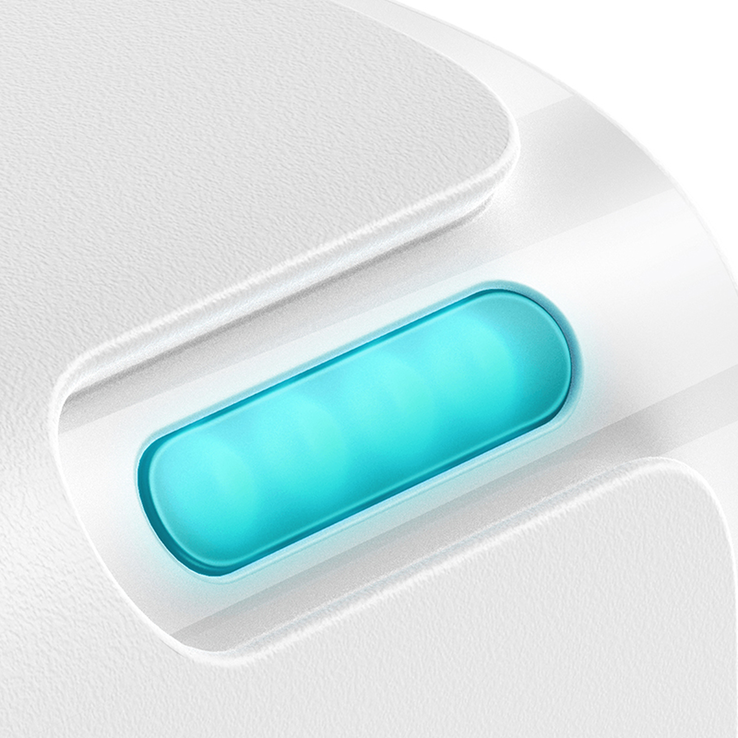 Primer plano de una superficie blanca y texturizada con un botón rectangular turquesa con tres luces brillantes.