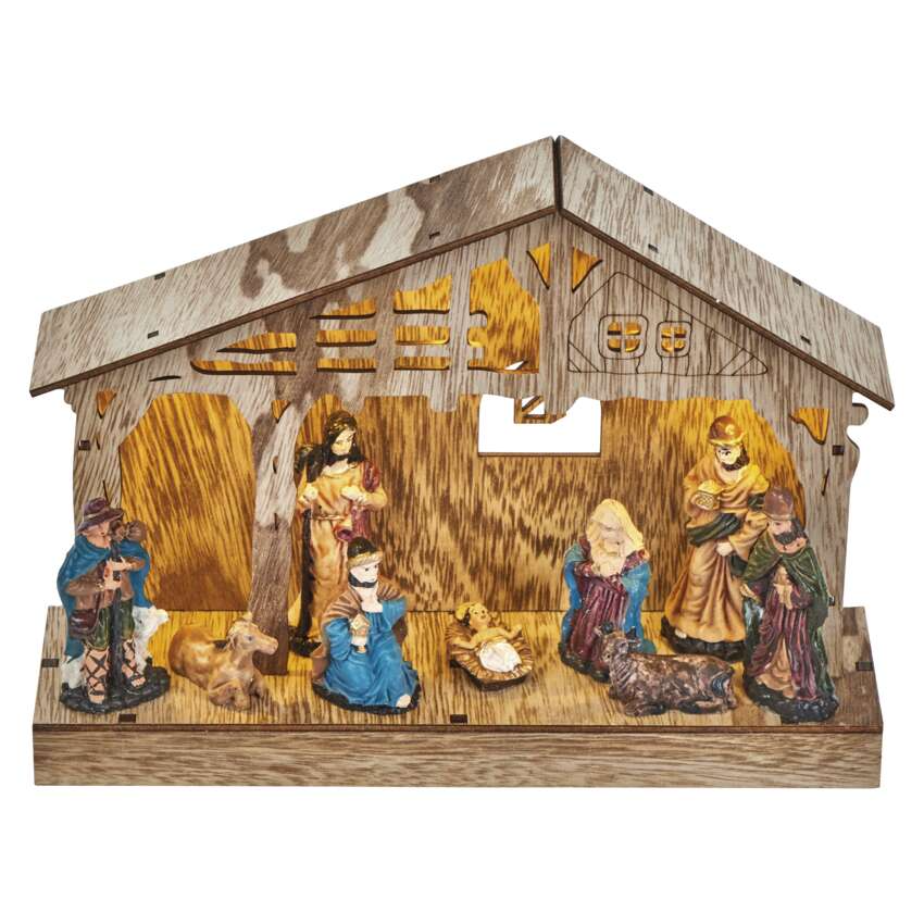 Betlehemi jelenet figurákkal egy faépítményen belül. Mária, József, a kis Jézus és más figurák.