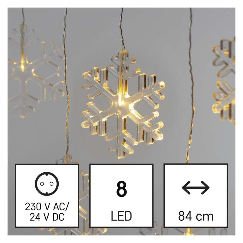 Hópelyhekből álló fényfüzér 8 LED-del, 84 cm hosszú, 230V AC/24V DC. Három hópelyheg lóg a szürke háttér előtt.