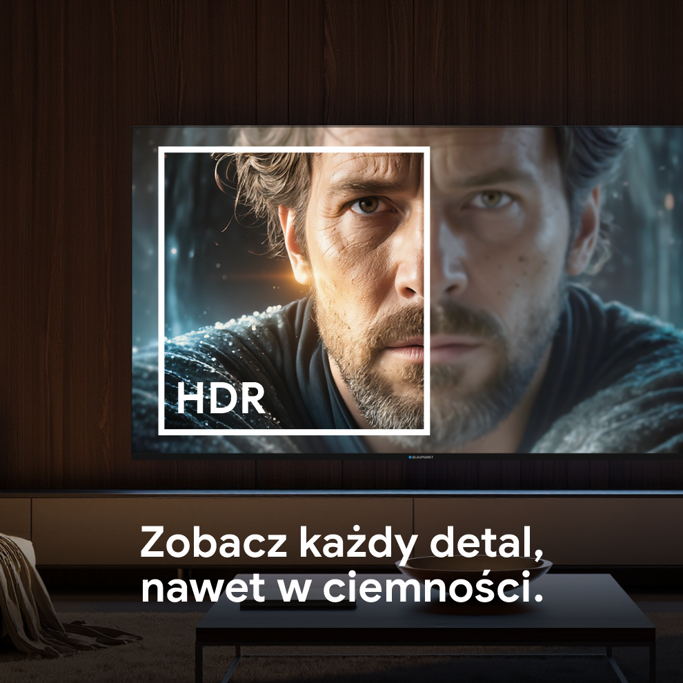 Twarz mężczyzny, podzielona na dwie części na ekranie telewizora, jedna strona oświetlona, druga zacieniona. Tekst: Zobacz każdy szczegół, nawet w ciemności.