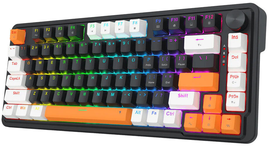 Klawiatura mechaniczna z czarną ramą, podświetlanymi na tęczowo klawiszami oraz pomarańczowymi i białymi akcentami. Posiada pokrętło głośności.