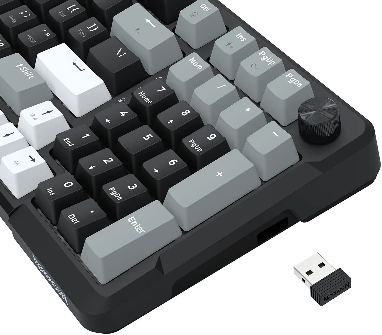 Czarna i szara klawiatura mechaniczna z kluczem USB. Klawisze są szare i czarne, z pokrętłem głośności.