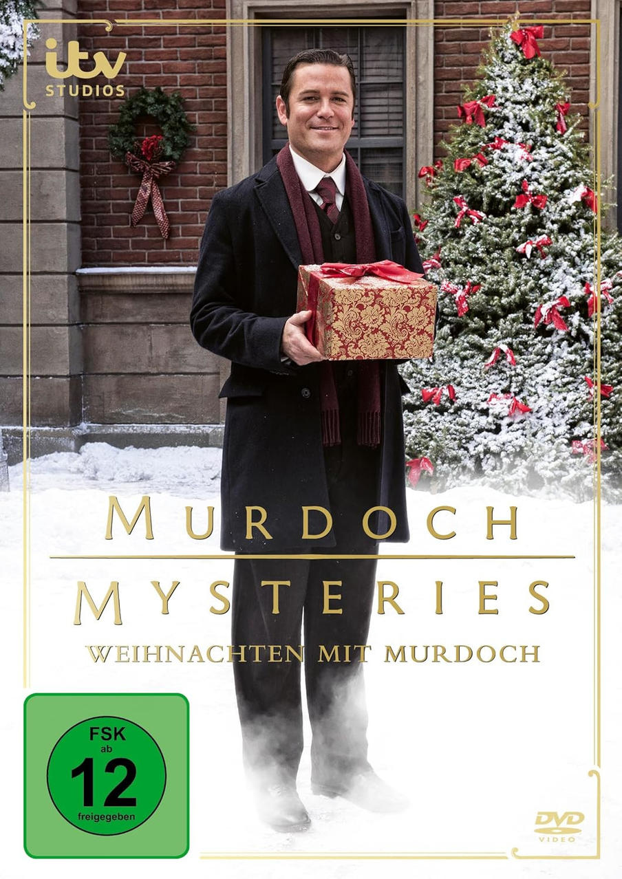 Mann mit Geschenkbox vor Weihnachtsbaum. DVD-Cover für Murdoch Mysteries: Weihnachtsspecial.