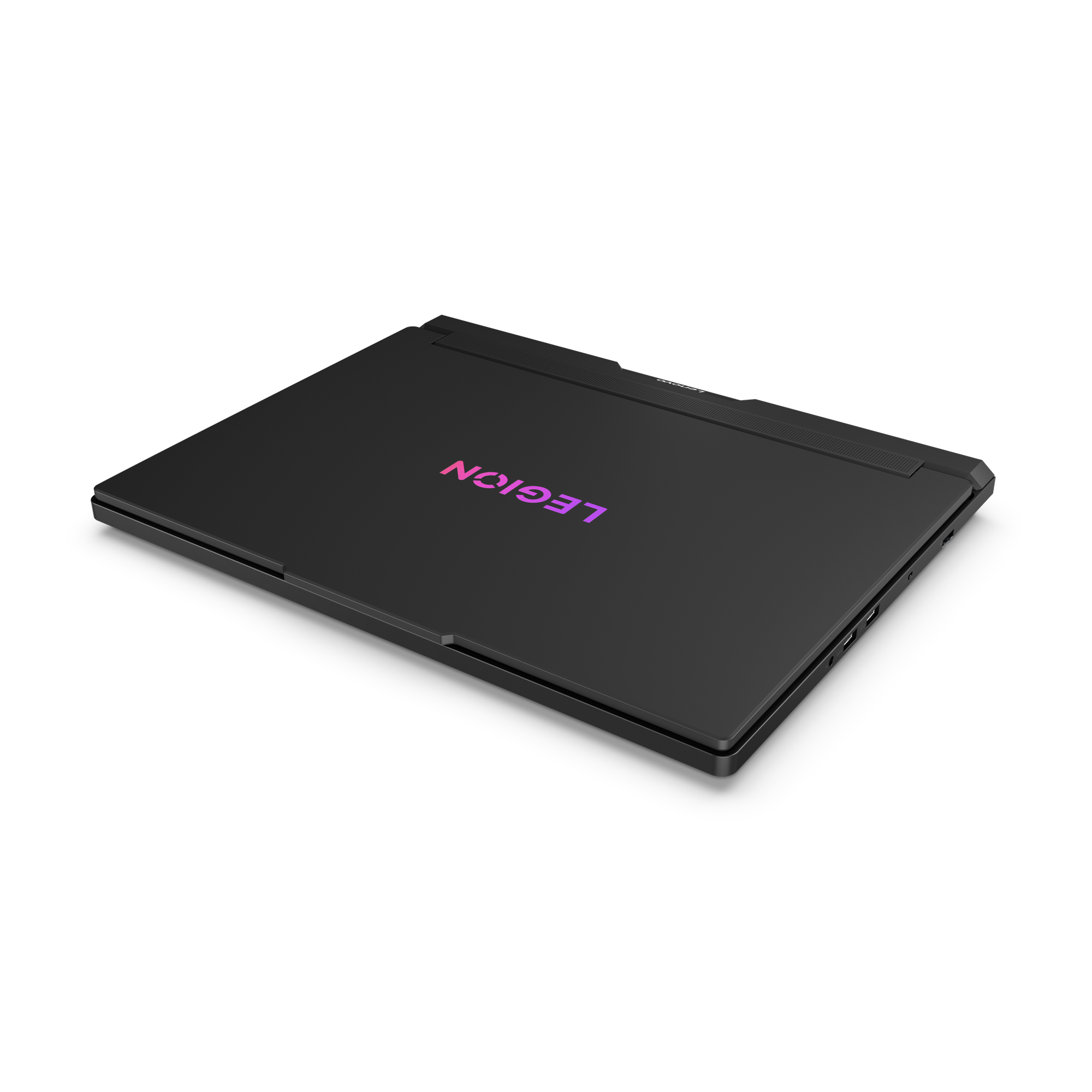 Schwarzer Laptop auf schwarzer Oberfläche. Das Wort "LEGION" befindet sich auf dem Laptop mit einem lila bis rosa Farbverlauf.