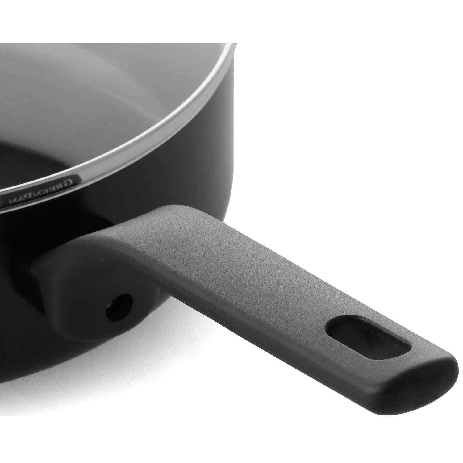 Close-up of a black saucepan with a gray handle. The rim is silver. The handle has a hole for hanging.