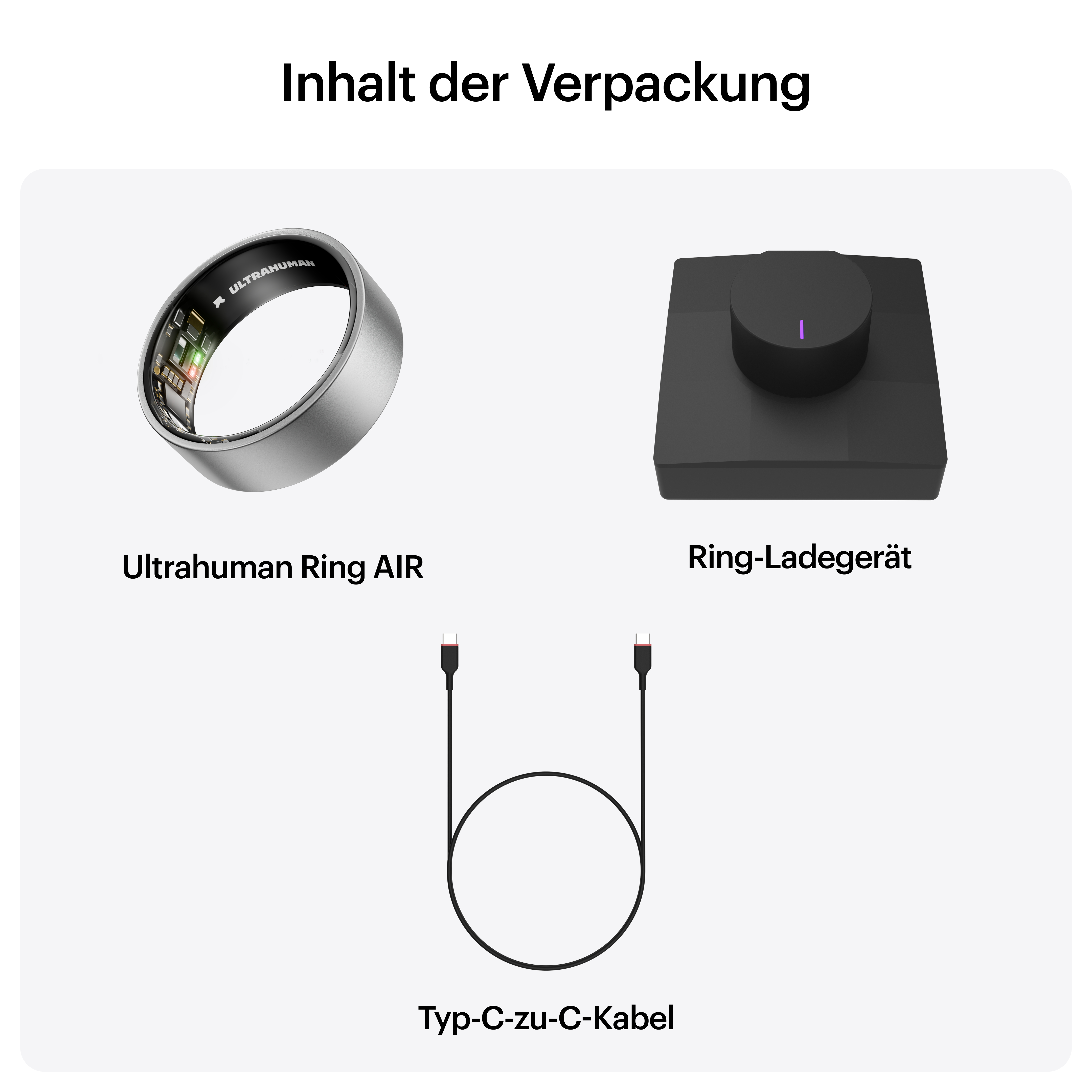 Das Bild zeigt einen Ultrahuman-Ring, eine Ladestation und ein USB-C-Kabel. Der Ring ist silber und schwarz.