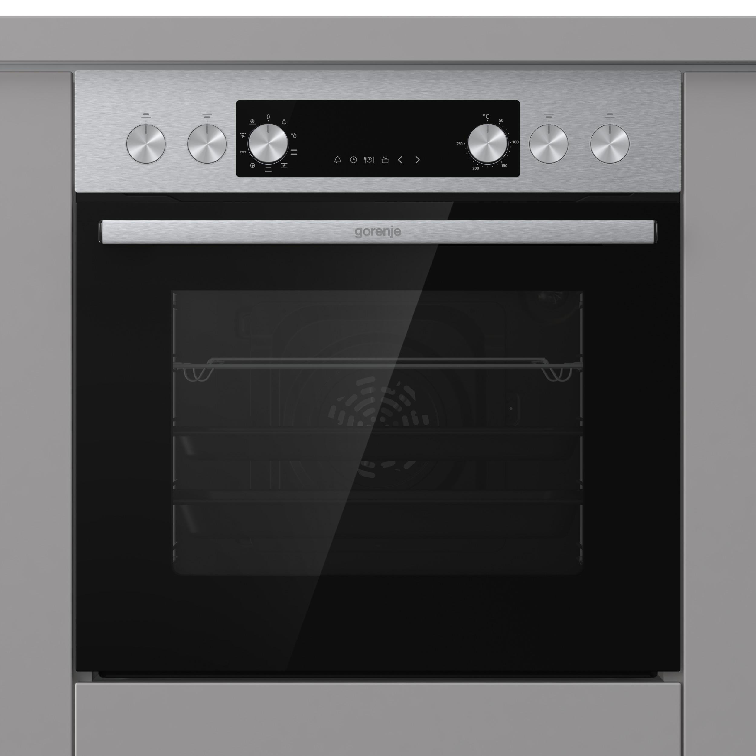 Ein Edelstahlbackofen mit Glastür. Er hat Knöpfe, ein Display und den Markennamen 'gorenje'.