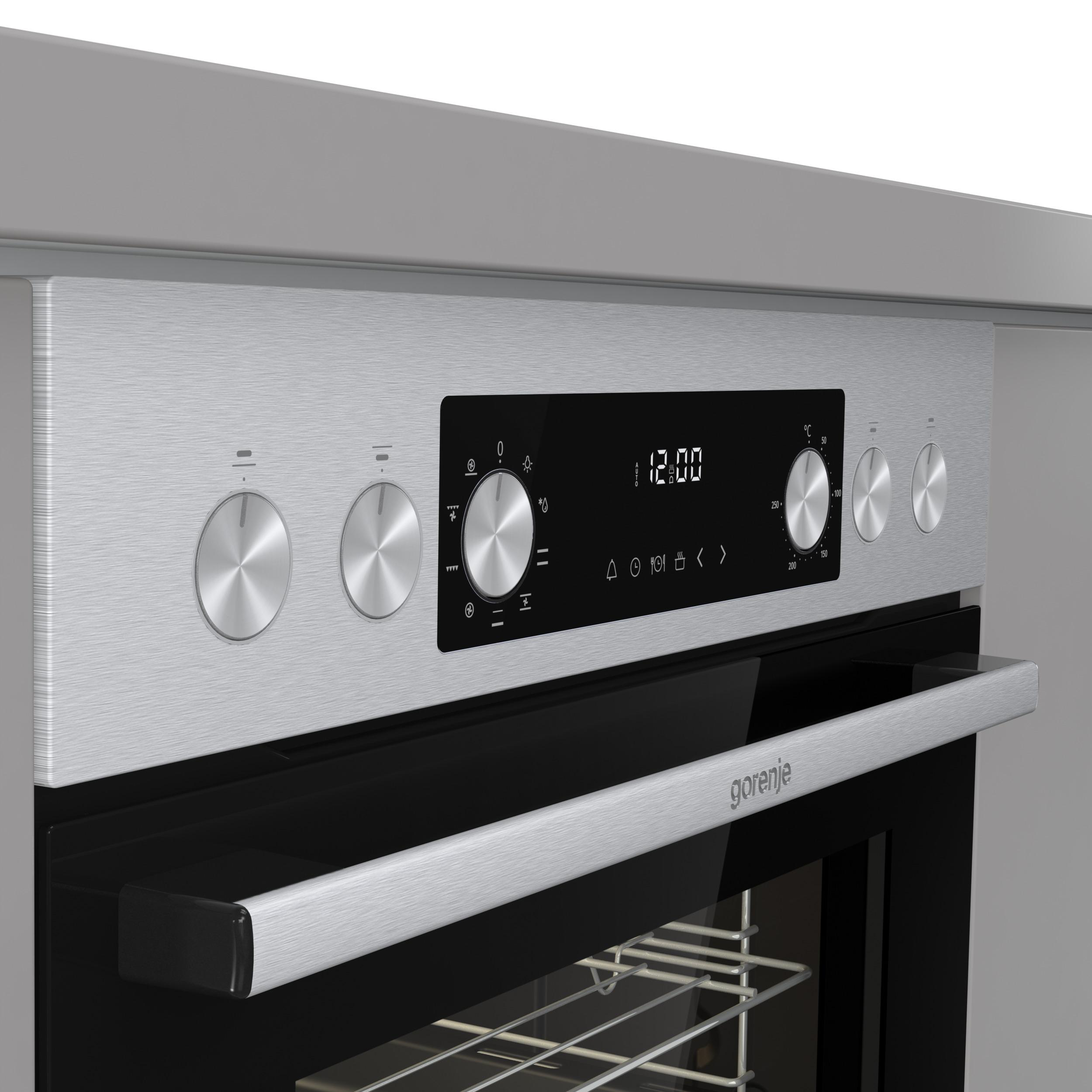 Ein Edelstahl-Backofen mit Drehknöpfen und einer Digitalanzeige mit der Uhrzeit 12:00. Der Markenname 'gorenje' ist sichtbar.