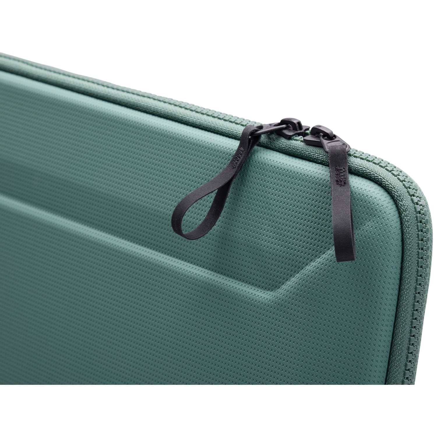 Close-up of a teal laptop case with a black zipper and pull tabs. The case has a textured surface and a white background.
