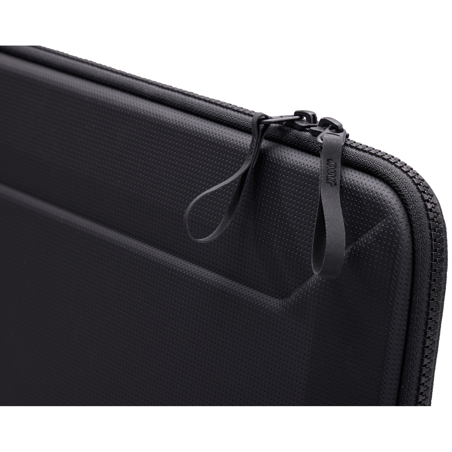 Close-up of a black laptop case with a zipper and a loop. The case has a textured surface with small dots.