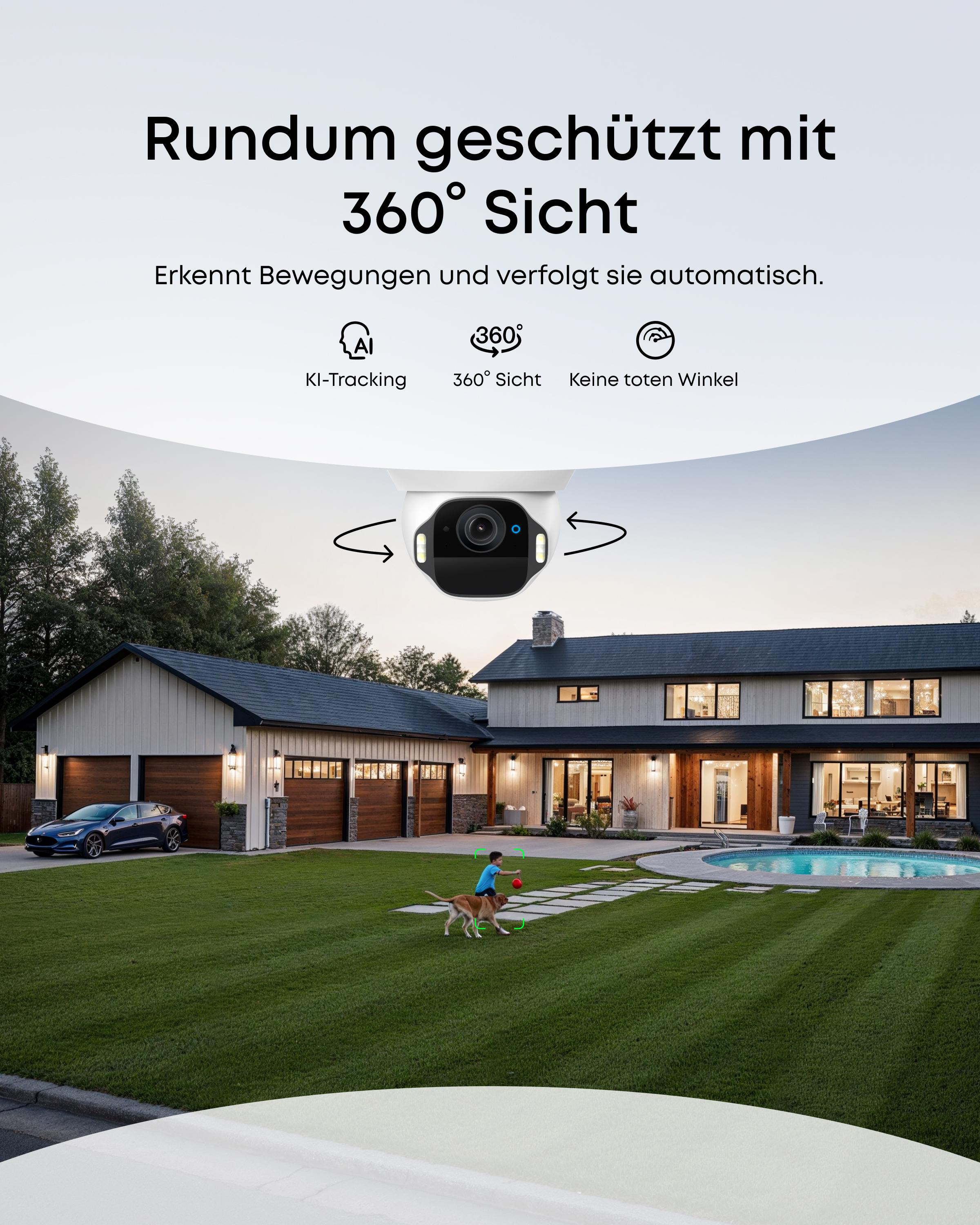 Ein Haus mit einem Jungen und einem Hund, die im Garten mit einem roten Ball spielen.