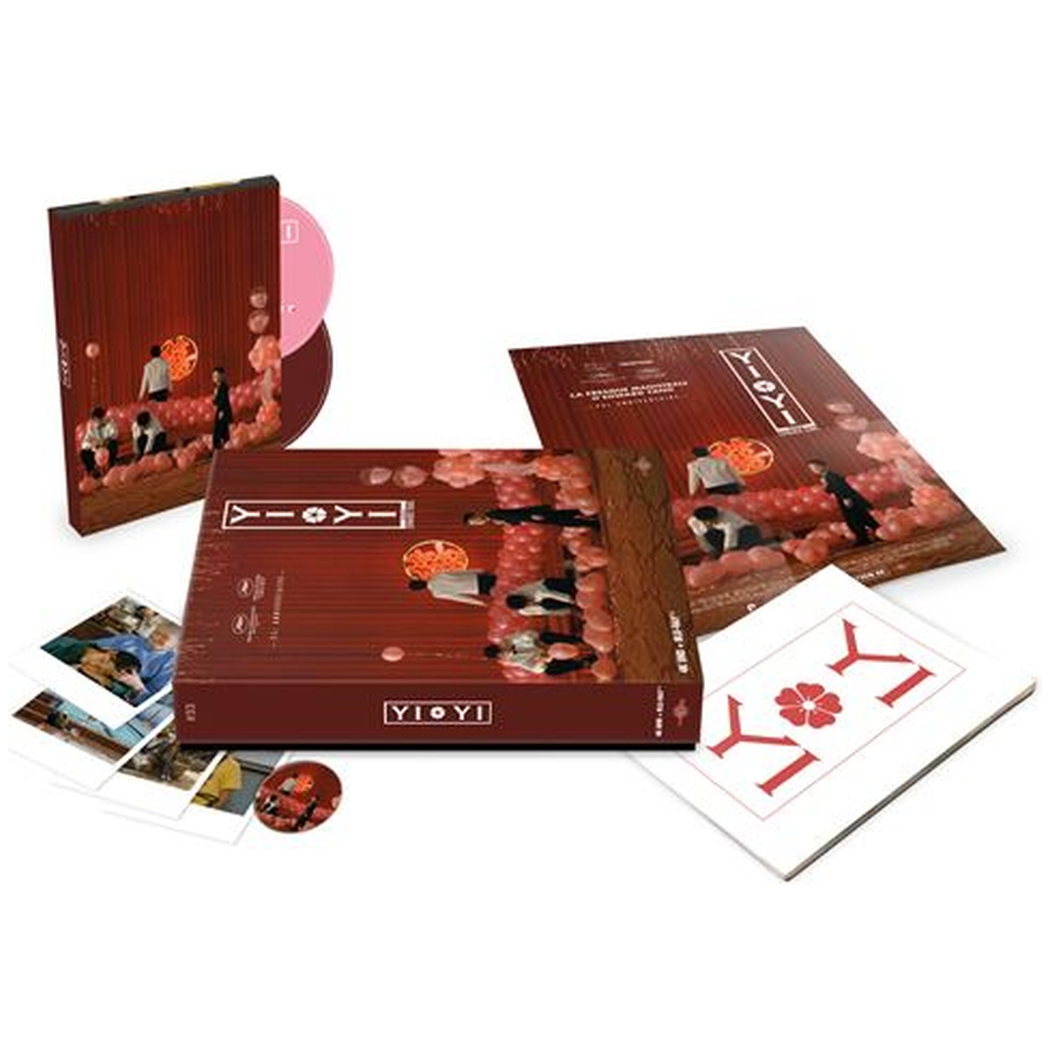 Un coffret CD avec plusieurs composants, dont une boîte, des disques et des cartes. La boîte présente une image de personnes avec des ballons rouges.