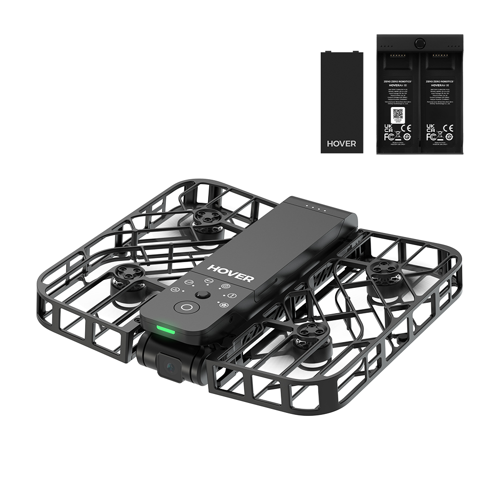 Dron Hover negra con jaula protectora, controlador y dos baterías. Tiene cámara y botones de control.
