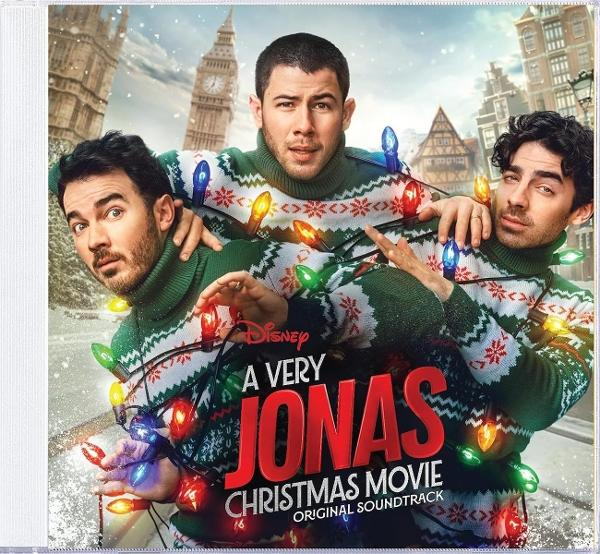 Die Jonas Brothers auf dem Cover eines Weihnachtsmusik-Soundtracks. Sie tragen Pullover und Lichterketten. Big Ben und andere Gebäude sind im Hintergrund.
