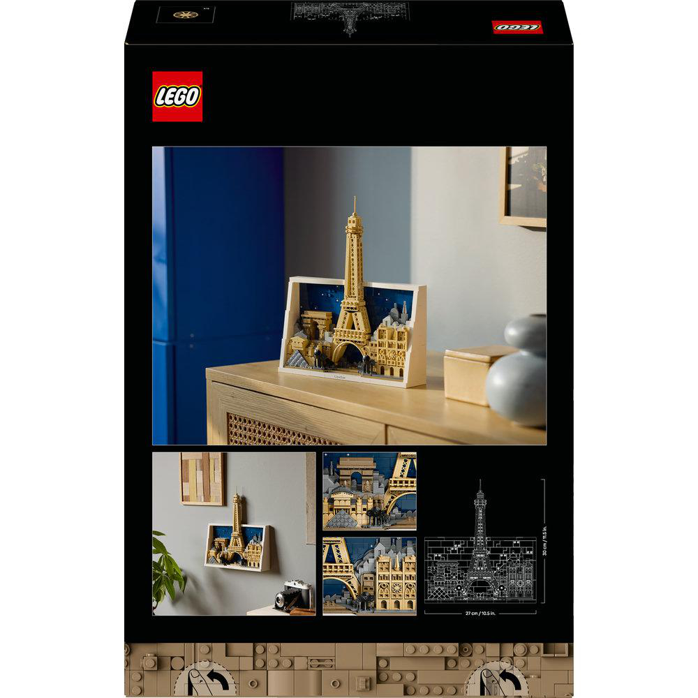 Die LEGO-Box zeigt ein Modell des Eiffelturms, das auf einer Holzoberfläche ausgestellt ist. Zusätzliche Bilder und ein Bauplan sind ebenfalls vorhanden.