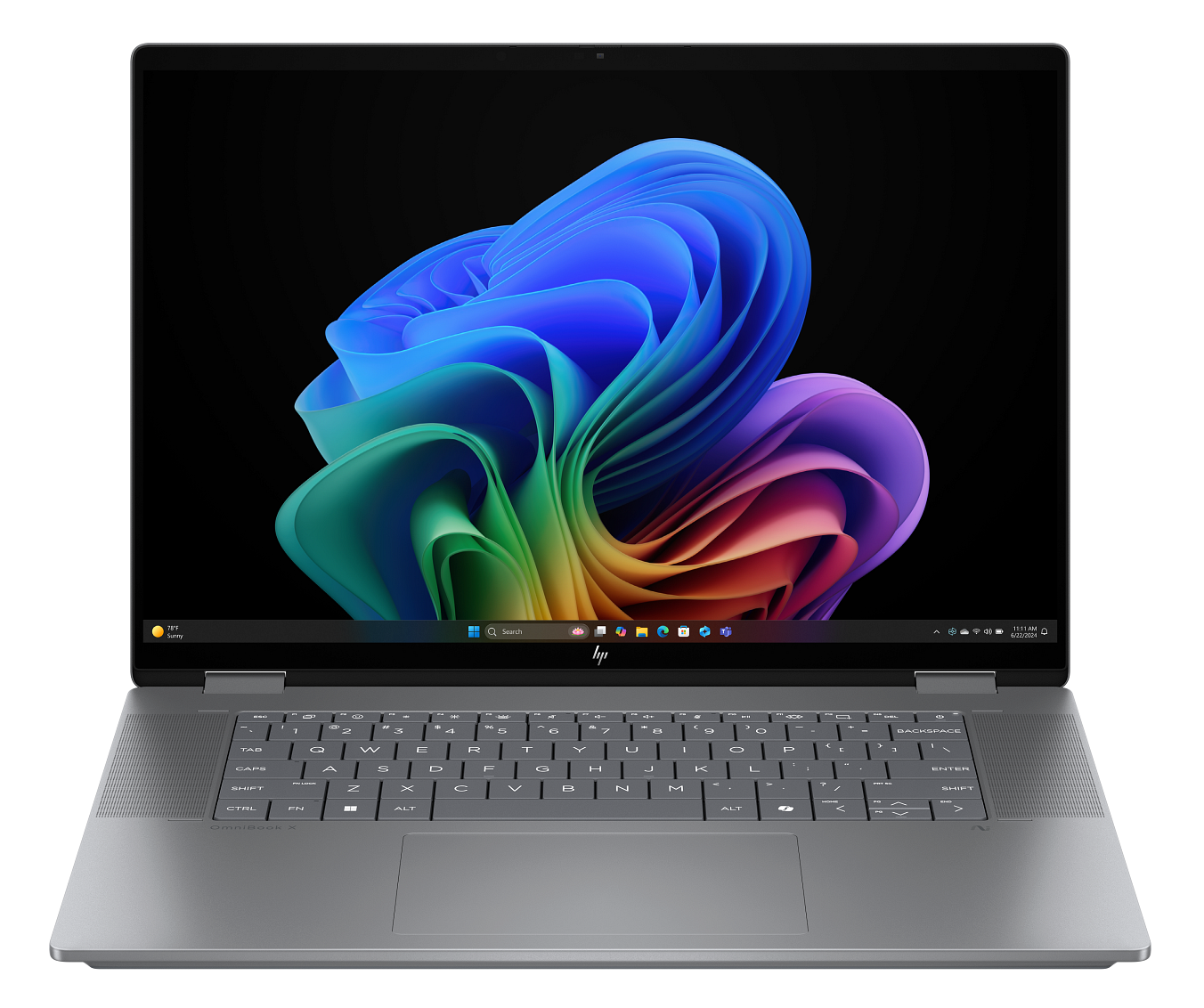 Otwarty laptop wyświetla kolorowy, abstrakcyjny obraz. Srebrna klawiatura na pierwszym planie. Czarne tło.