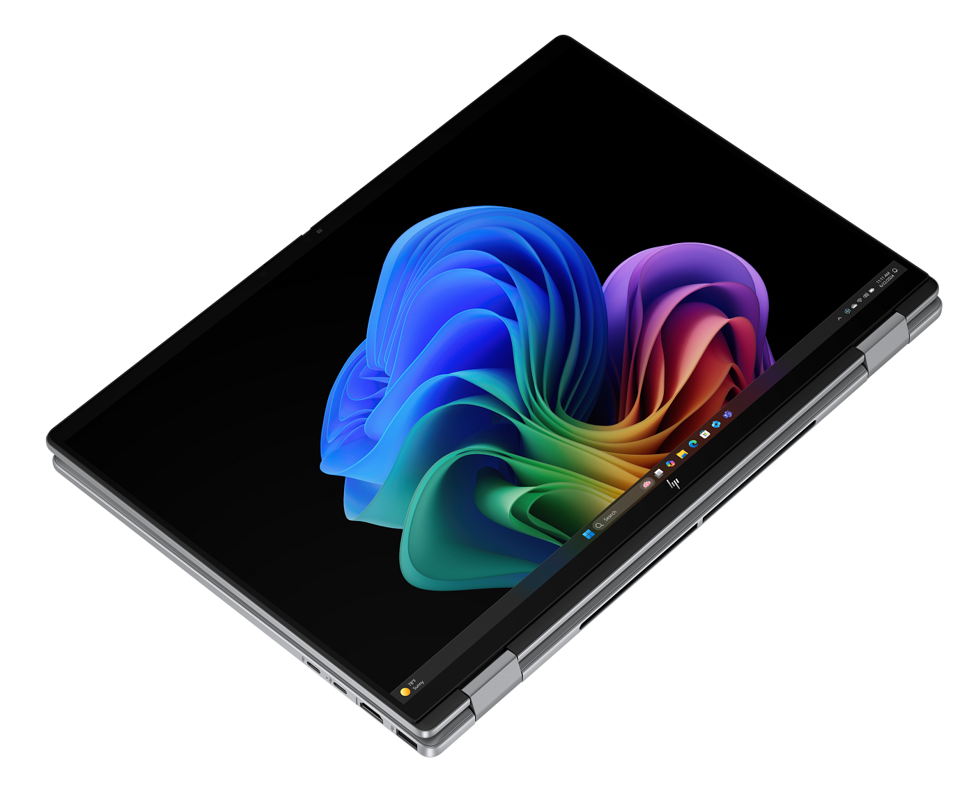 Laptop na czarnym tle. Ekran pokazuje kolorowy, abstrakcyjny wzór. Laptop otwarty pod kątem.