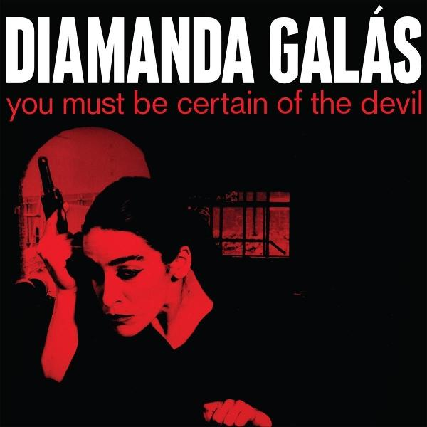 Albumcover. Diamanda Galás, Titel in Weiß. Rot getöntes Foto einer Frau mit Waffe, die nach unten schaut. Dunkler Hintergrund.