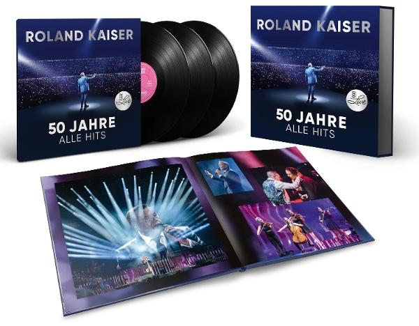 Album-Set mit Roland Kaiser, Schallplatten und Fotobuch. Albumcover zeigt Kaiser auf der Bühne. Buch zeigt Konzertfotos.