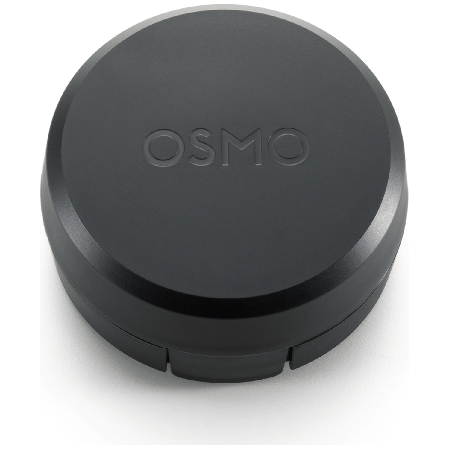 Een zwart, cirkelvormig apparaat met het woord 'OSMO' erop. Het apparaat staat op een wit oppervlak.