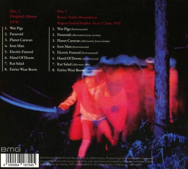 Pochette d'album : listes des pistes du disque 1 et du disque 2. Figures floues dans des tons rouges et bleus. Logo BMG et code-barres en bas.
