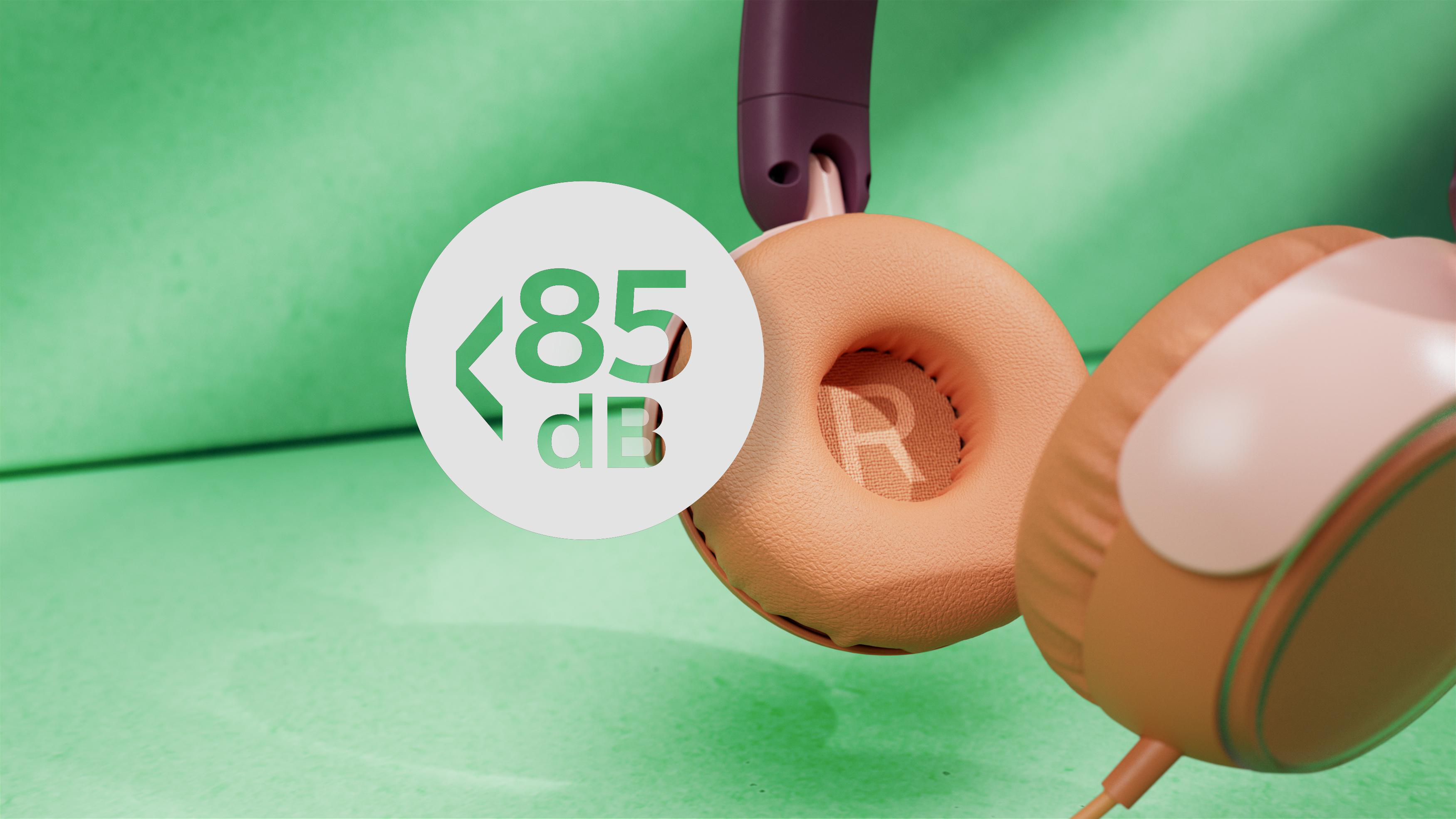 Kopfhörer mit pfirsichfarbenen Ohrmuscheln und lila Kopfband. Ein weißer Kreis zeigt 85 dB. Grüner strukturierter Hintergrund.