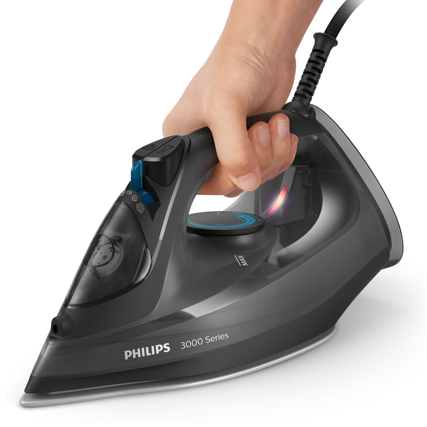 A black Philips 3000 Series iron is held by a hand. It has blue and black details, a dial, and a cord. The soleplate is silver.
