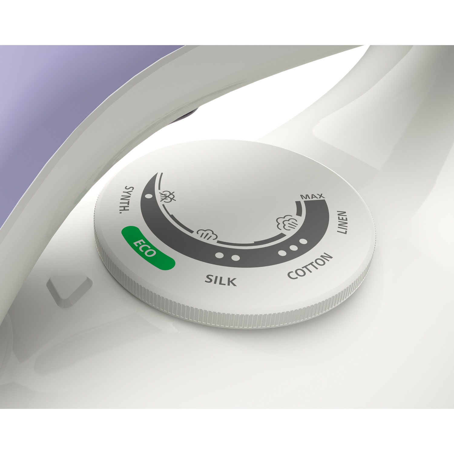 Close-up of an iron's settings dial. The dial is white with labels like 'Silk', 'Cotton', and 'Linen'. The dial is on white surface.