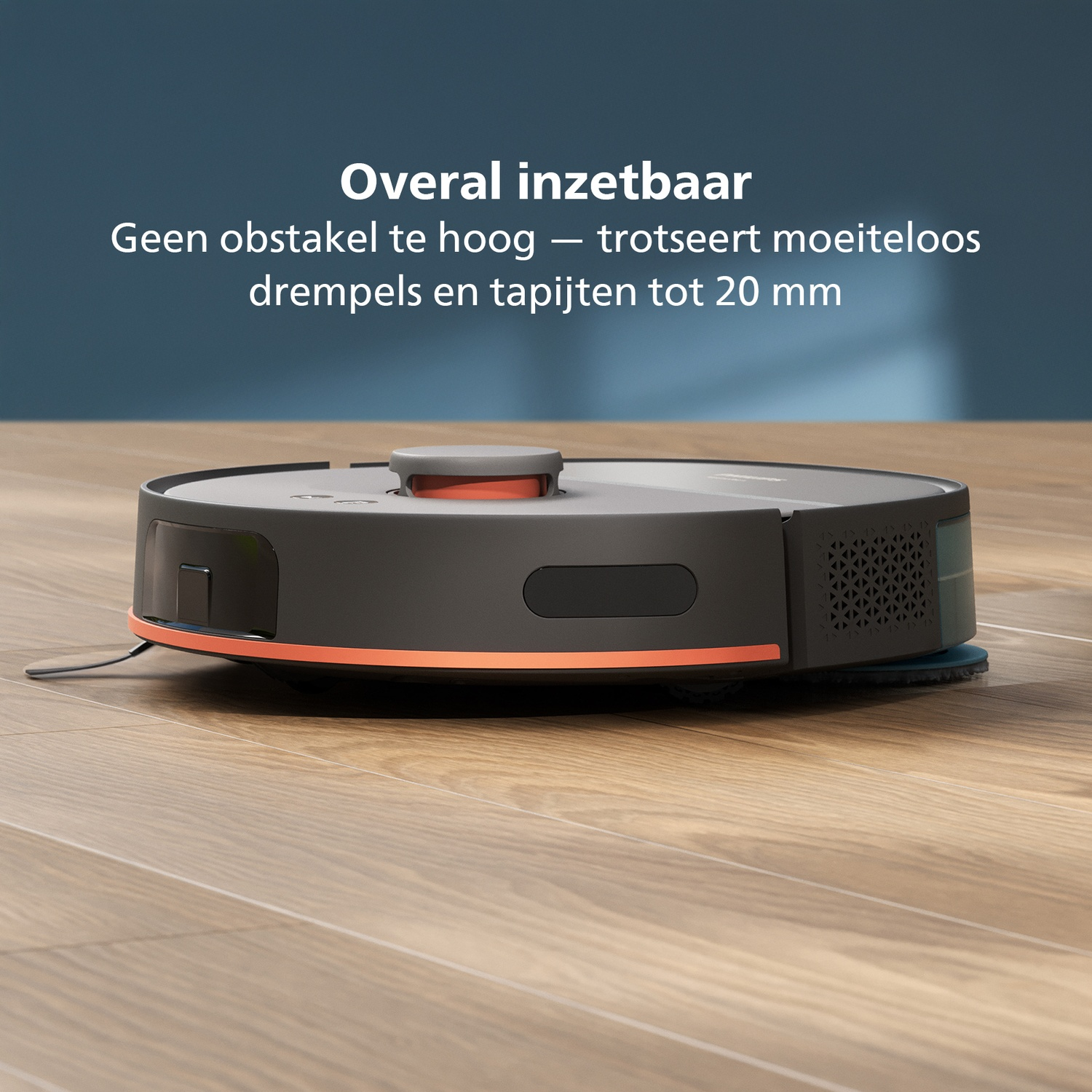 A black and gray robot vacuum cleaner with orange accents sits on a wooden floor. Text says it handles obstacles up to 20mm.