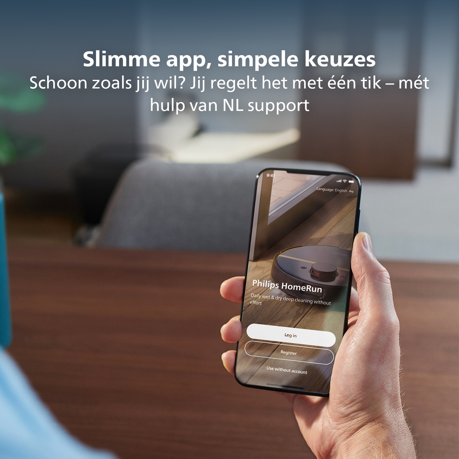 A hand holding a smartphone displays a Philips HomeRun app interface with login options. Background: blurry room.