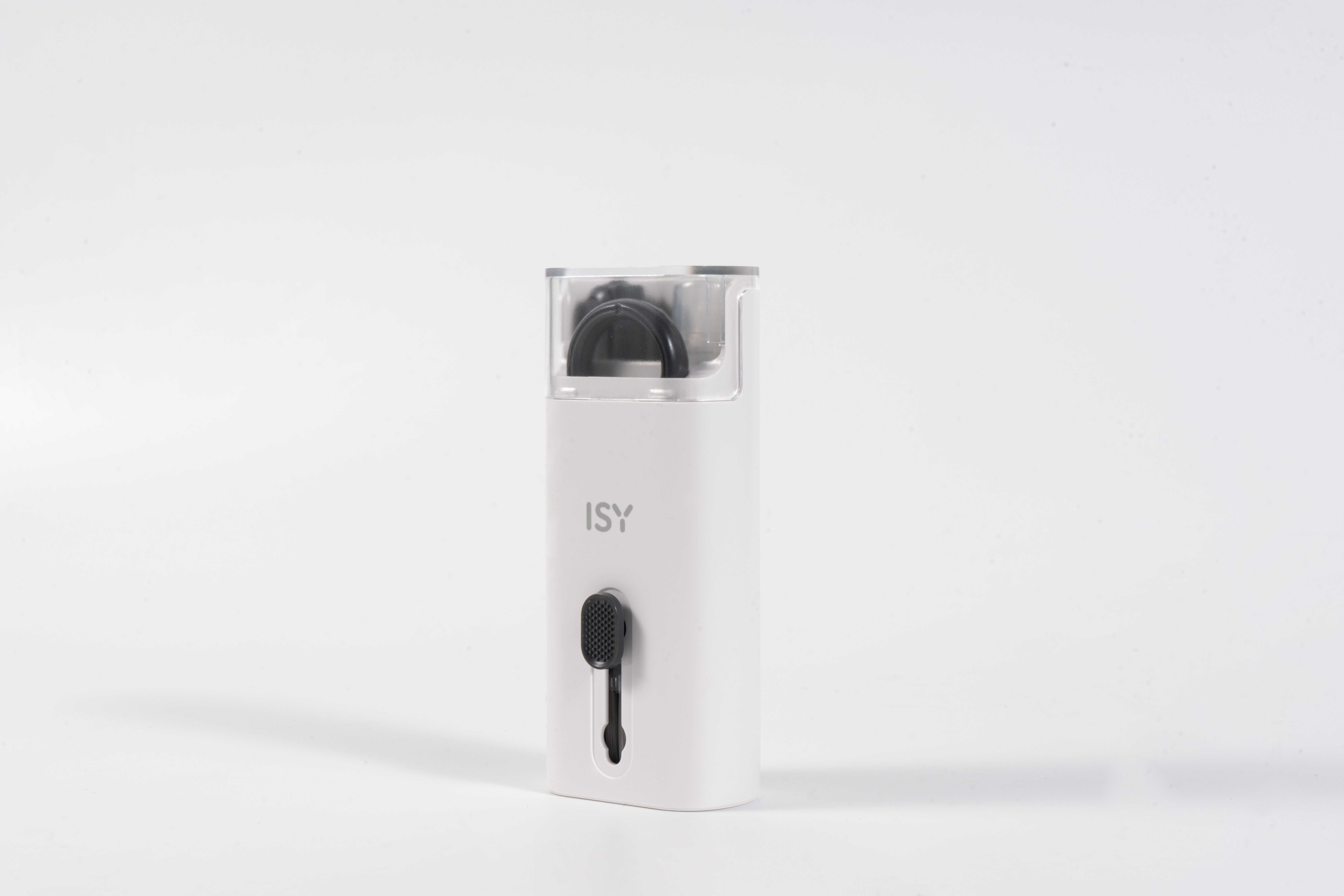 Białe urządzenie ISY z czarnym przyciskiem i przezroczystym wierzchem, na białej powierzchni.