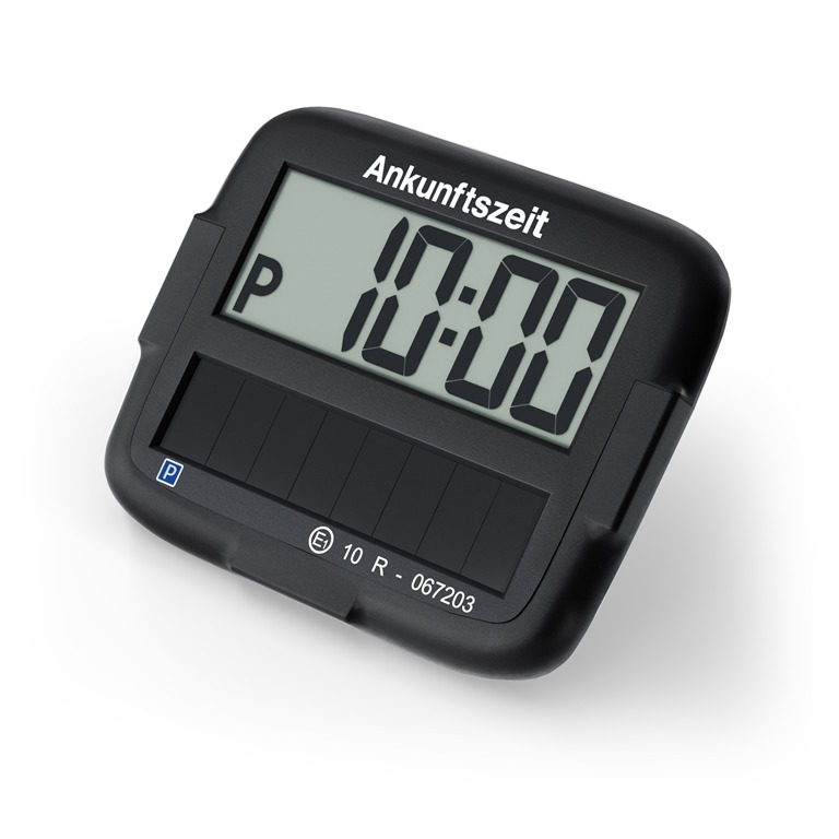 Ein schwarzer Parktimer zeigt 10:00 an. Der Text 'Ankunftszeit' steht über dem Display. Der Timer hat ein 'P' Symbol und weitere Details.