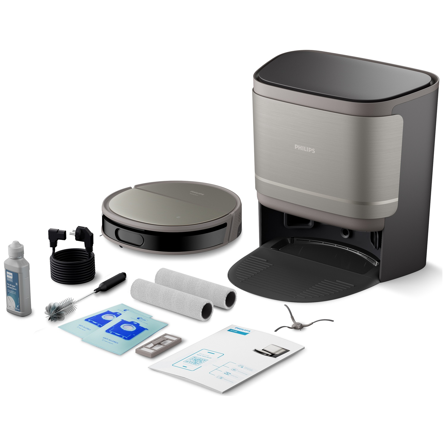 Een Philips robotstofzuiger en oplaadstation met accessoires: reiniger, borstel, filters, rollen en een handleiding, alles op een witte achtergrond.
