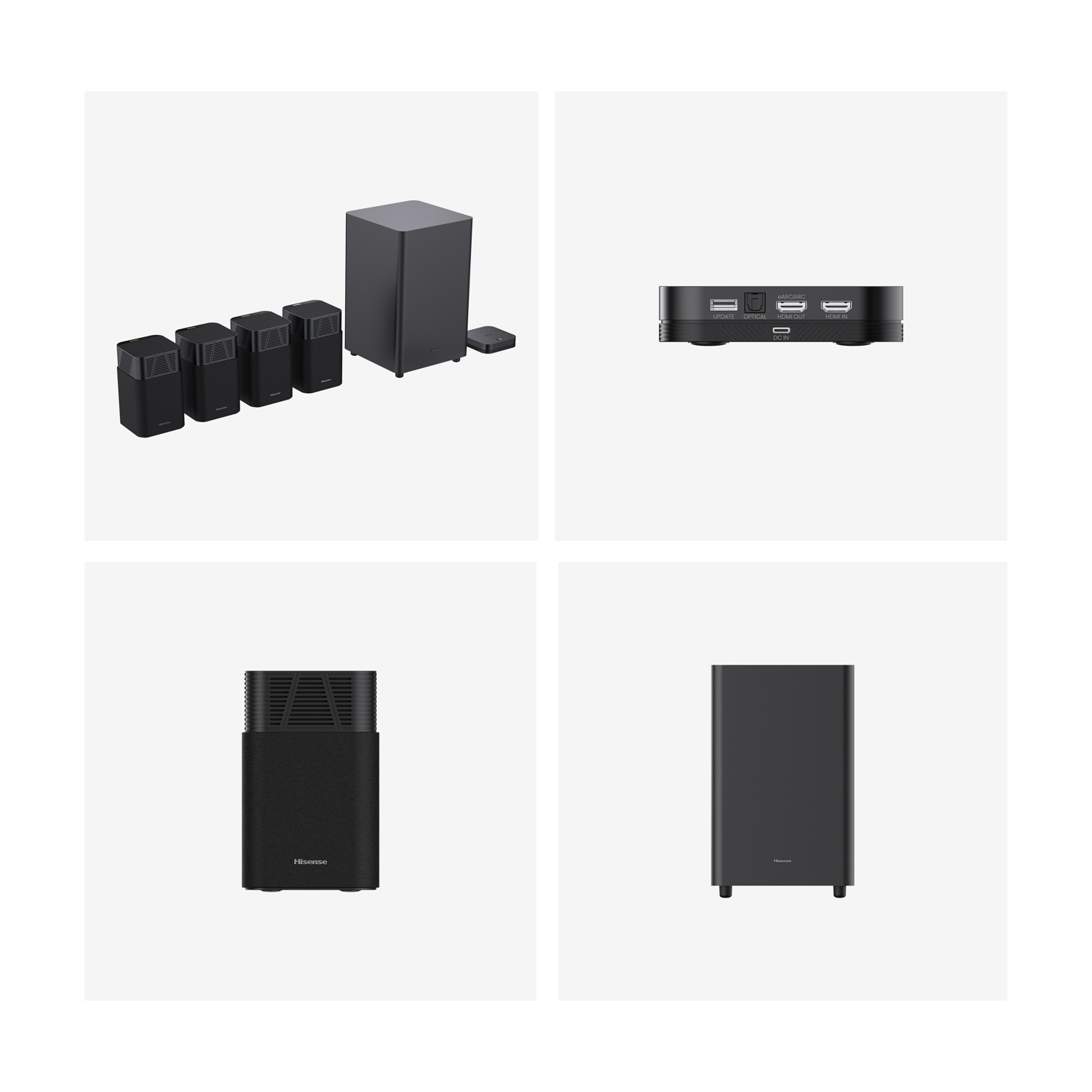 Un sistema audio con più altoparlanti neri, un subwoofer e una piccola unità di controllo. Su sfondo bianco.