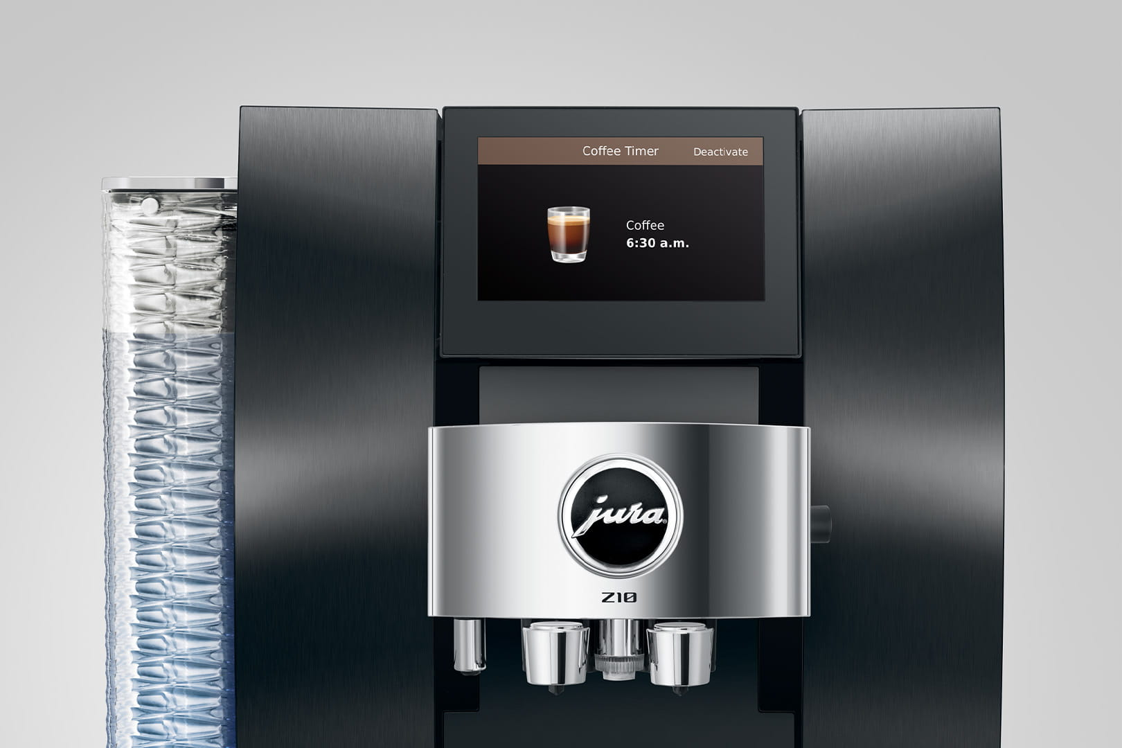 Una macchina da caffè Jura Z10 nera. Lo schermo mostra il caffè alle 6:30 e un timer per il caffè. Un serbatoio d'acqua è visibile.