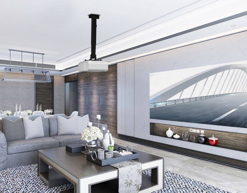 Wohnzimmer mit Projektor, Sofa, Couchtisch und Leinwand mit Brücke. Der Raum hat modernes Design und Dekoration.