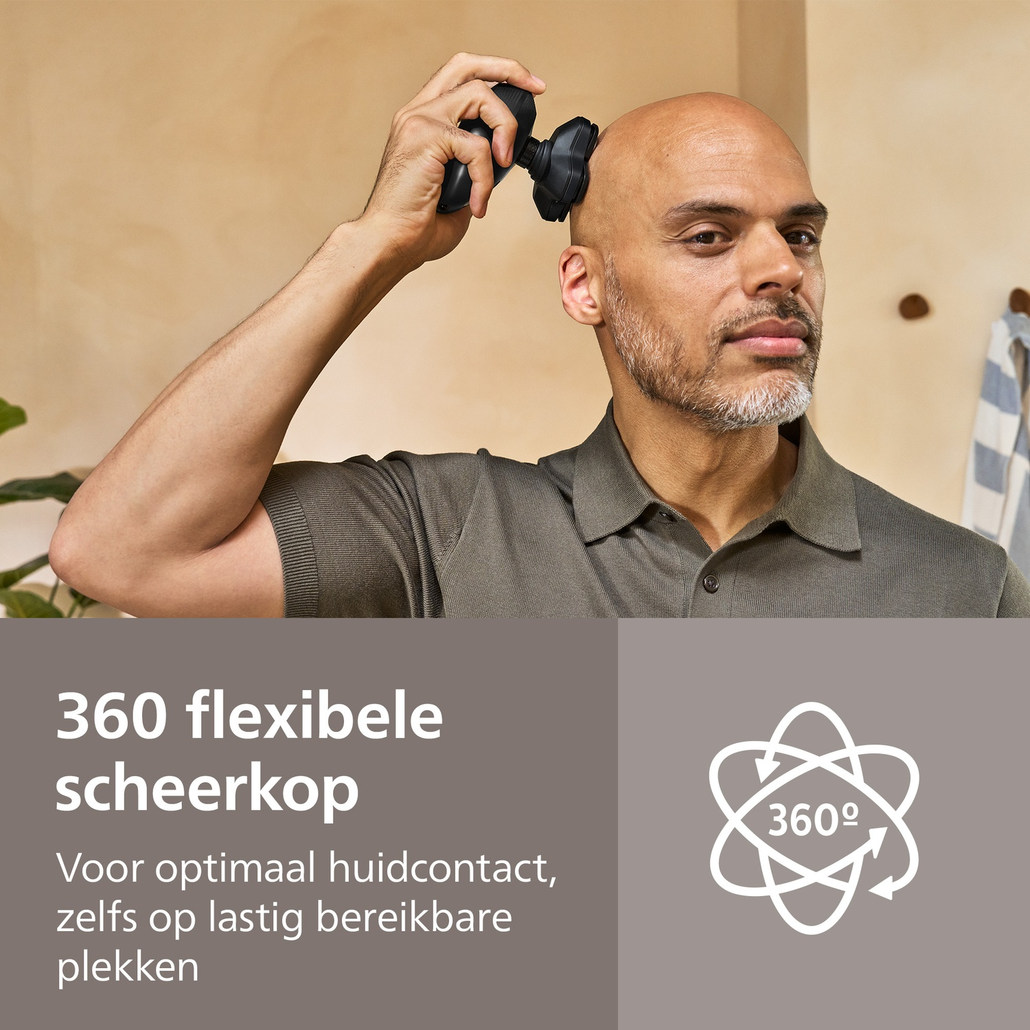 A bald man shaves his head with a black shaver. He wears a green shirt. Text says '360 flexible shaving head'.