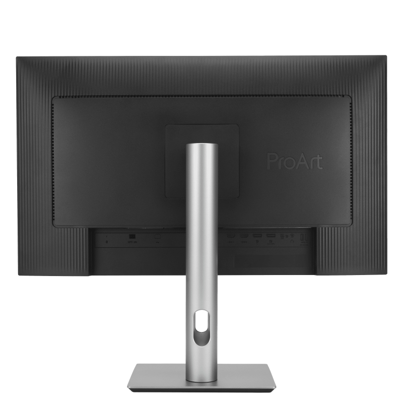 La parte trasera de un monitor de computadora negro con un soporte plateado. El monitor tiene un logotipo ProArt y varios puertos.