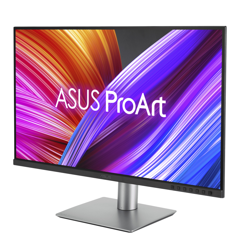 Monitor ASUS ProArt con pantalla colorida, soporte plateado y marco negro. Muestra arte abstracto con morado, naranja y blanco.