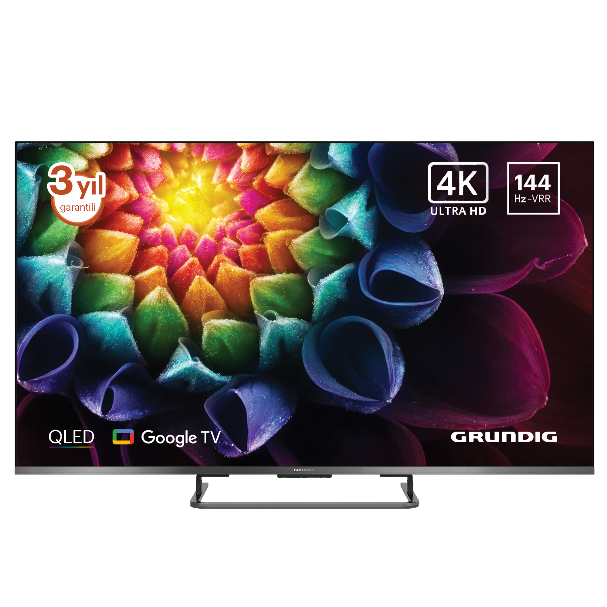 Bir Grundig TV, renkli bir çiçek görüntüsü görüntüler. Özellikleri arasında 4K Ultra HD, 144 Hz-VRR, QLED ve Google TV bulunur. 3 yıl garantisi vardır.