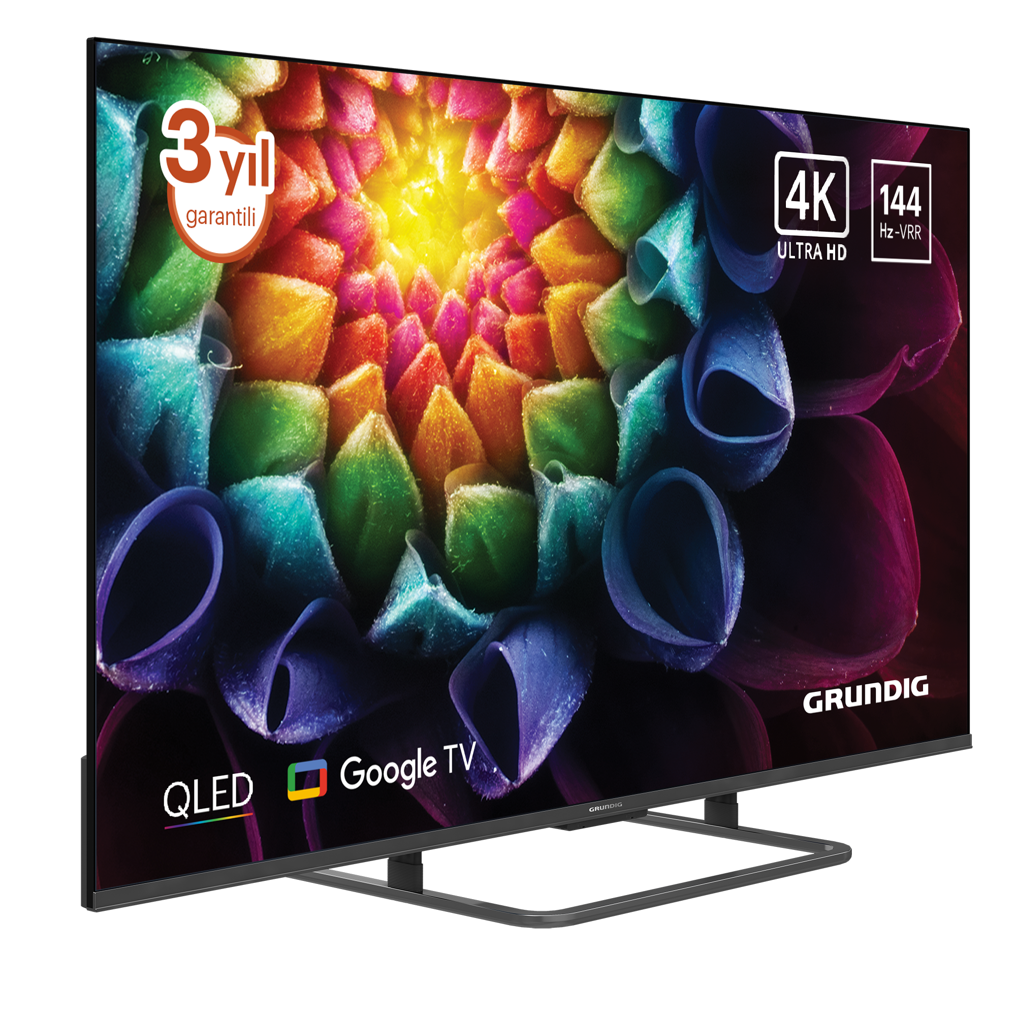 Bir Grundig QLED 4K TV. Ekran renkli bir çiçek deseni gösteriyor. 3 yıl garantisi ve Google TV'si var.