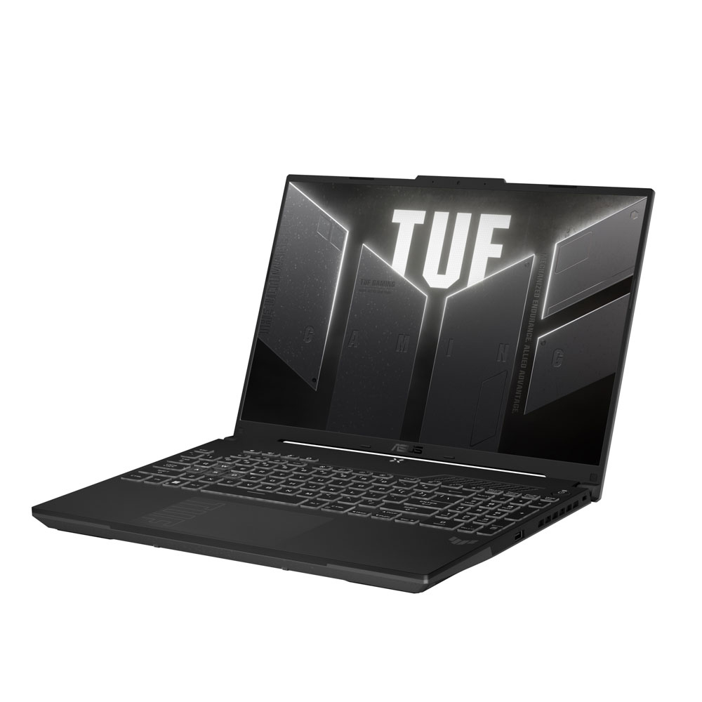 Siyah ASUS TUF oyun laptopu. Ekran bir logo gösteriyor. Klavye görünür durumda. Laptop açılı, yan tarafı gösteriyor.