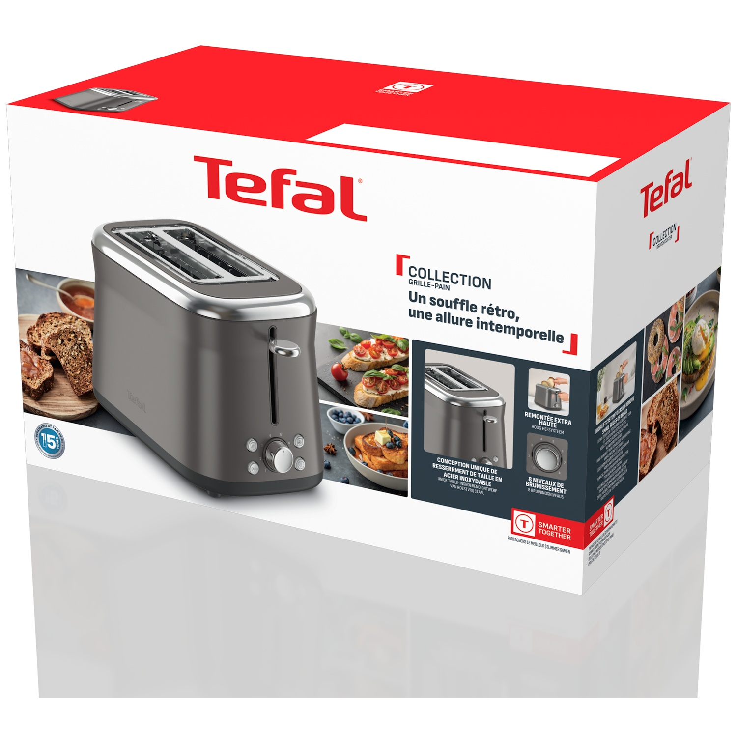 Tefal toaster in its box. The box is white and red. The toaster is grey and silver.