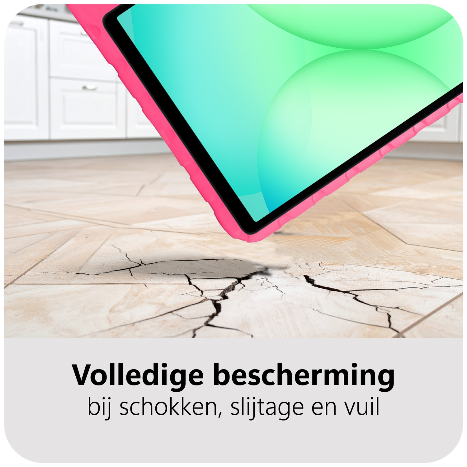 A tablet with a pink case is falling, about to hit and crack the floor. White cabinets are in the background.