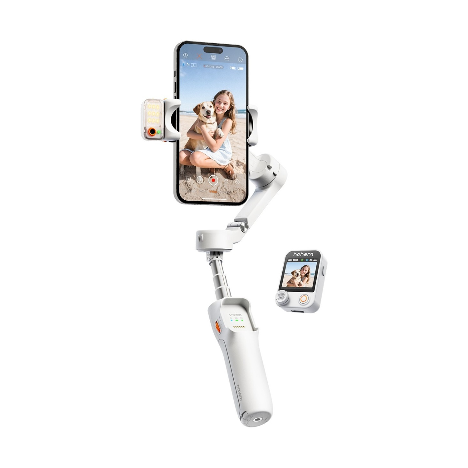 Un telefono in un gimbal mostra una ragazza con un cane sulla spiaggia. È visibile anche un controller secondario.